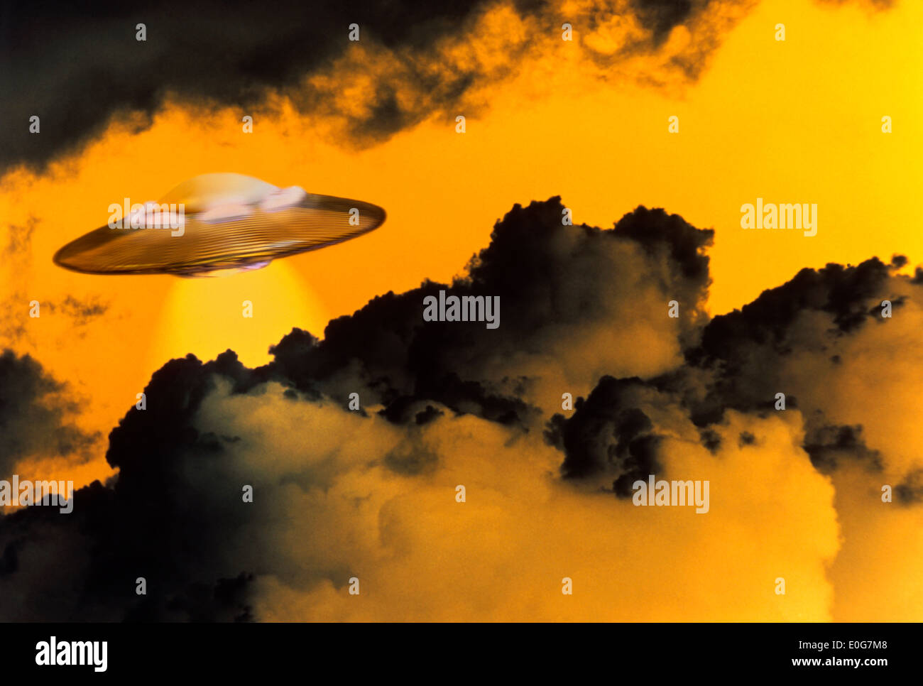 UFO flying through clouds Stock Photo