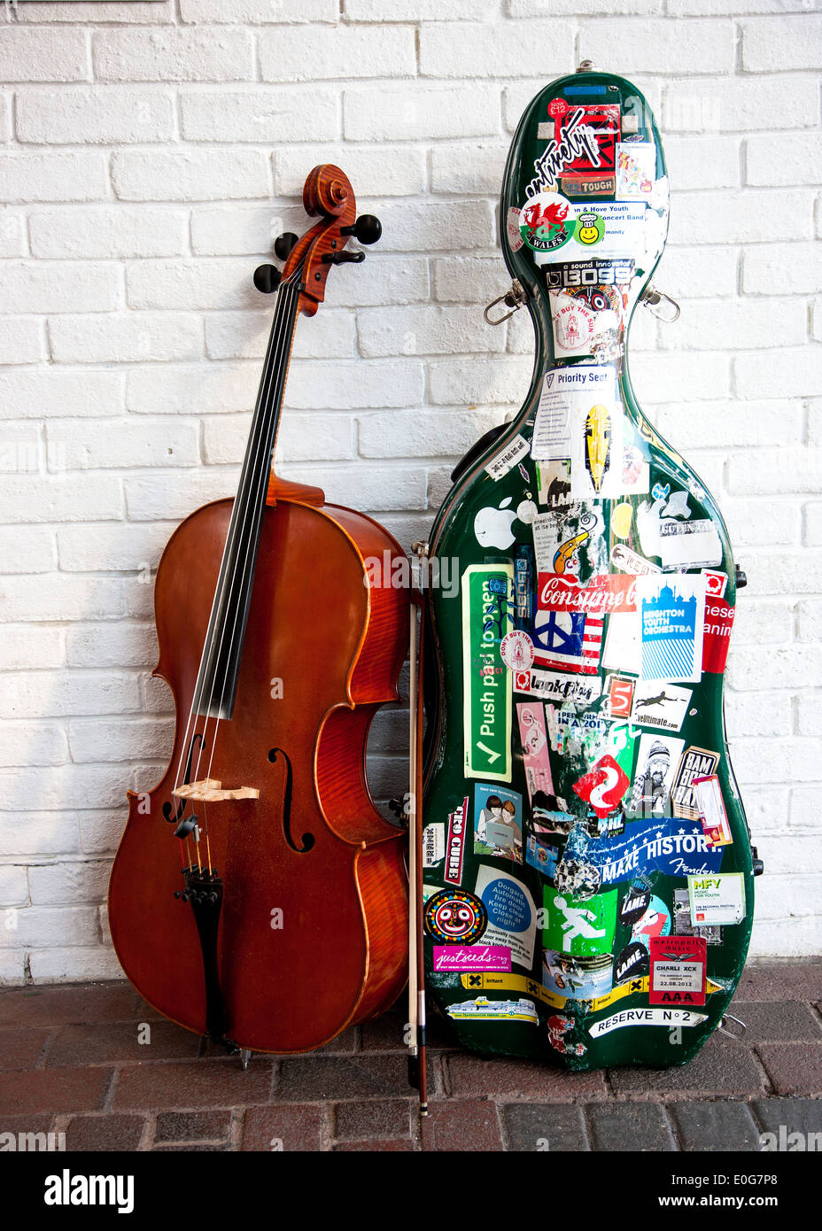 A double bass cello for a busker Stock Photo Alamy