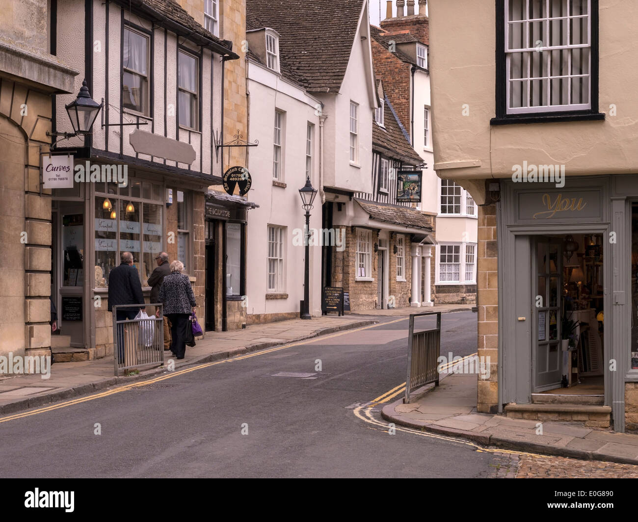 Attractive traditional old shop fronts and stone buildings, Stamford, Lincolnshire, England, UK Stock Photo