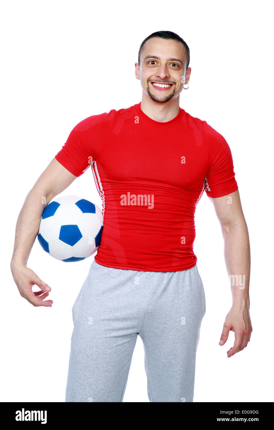 Crazy sportive man holding soccer ball over white background Stock Photo