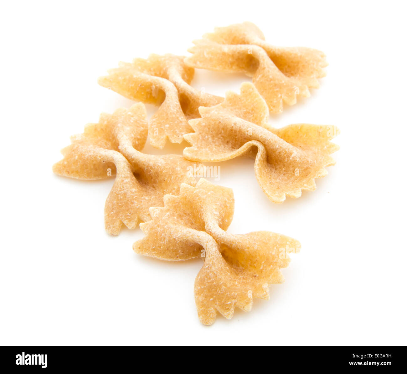 wholegrain pasta farfalle isolated on white background Stock Photo