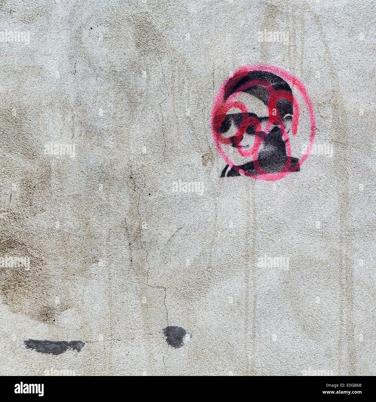 Stencil street art and graffiti male head with sunglasses and red