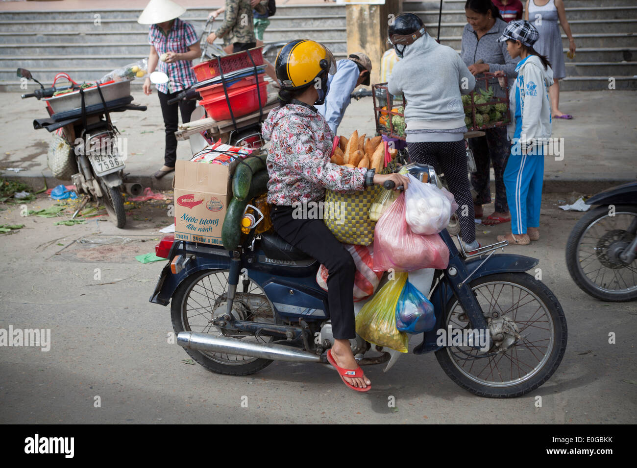 Loaded Motorbike at Market in Old Town Hoi An Vietnam Stock Photo