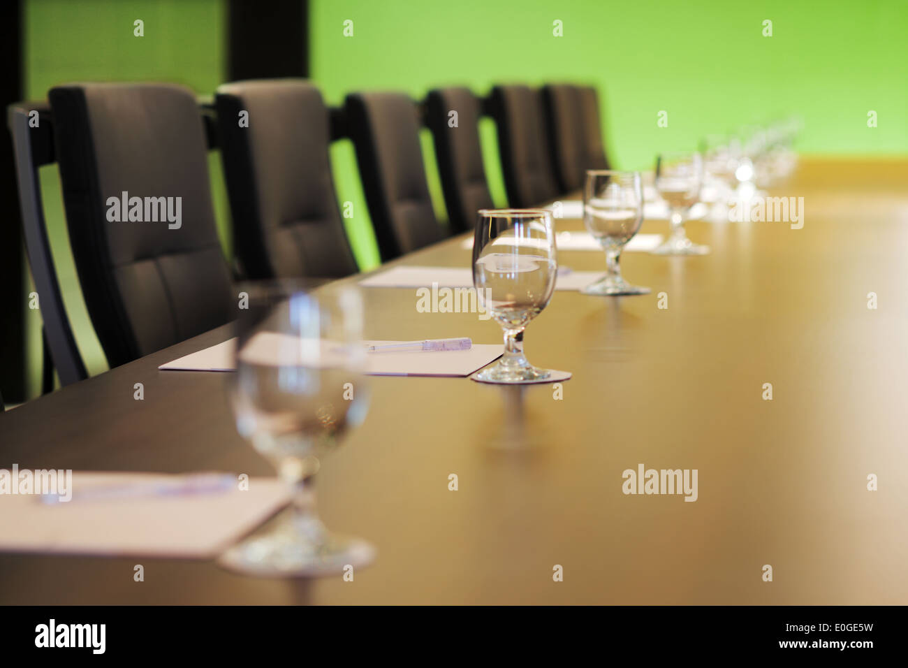 The boardroom table is set for the Annual General Meeting Stock Photo