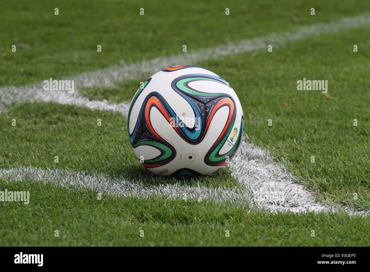 Adidas football sitting in corner-quadrant on a football pitch Stock Photo