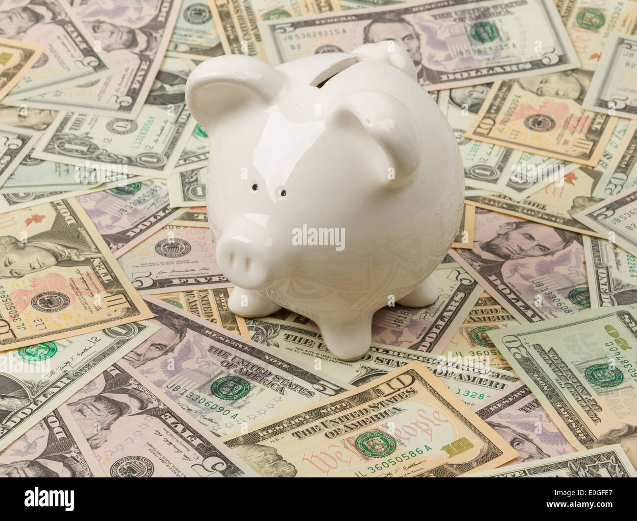Piggy bank on 1 ,5, 10 and 20 dollar bills Stock Photo