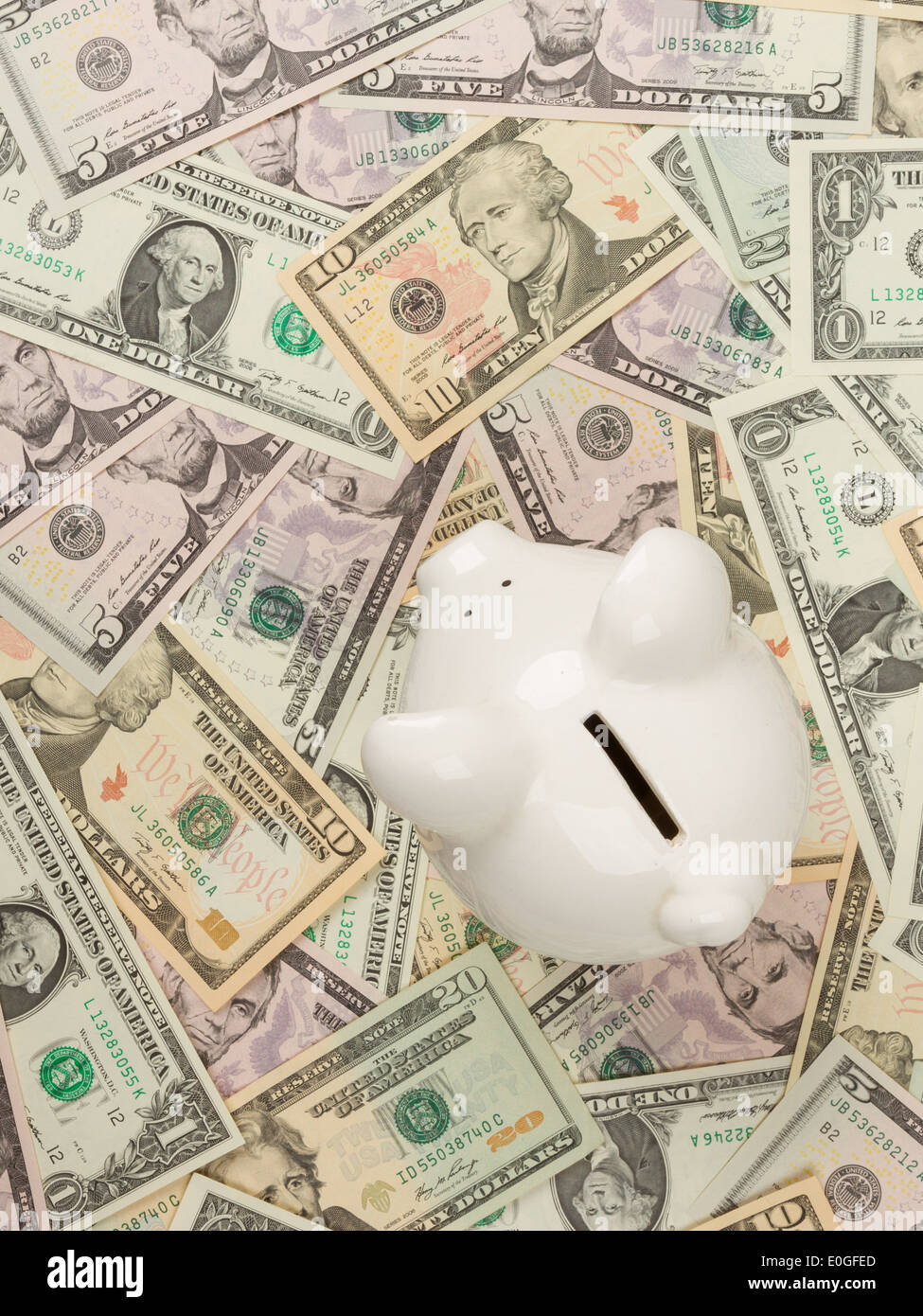 Piggy bank on 1 ,5, 10 and 20 dollar bills Stock Photo