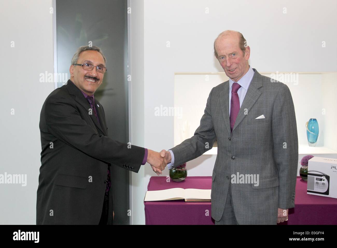Kings Langley, Hertfordshire, UK. 13th May 2014. HRH Prince Edward, Duke of Kent visits Imagination Technologies, the company behind the technology in Pure DAB Digital Radios, pictured here with Sir Hossein Yassaie, Imagination Technologies' CEO Credit:  Neville Styles/Alamy Live News Stock Photo