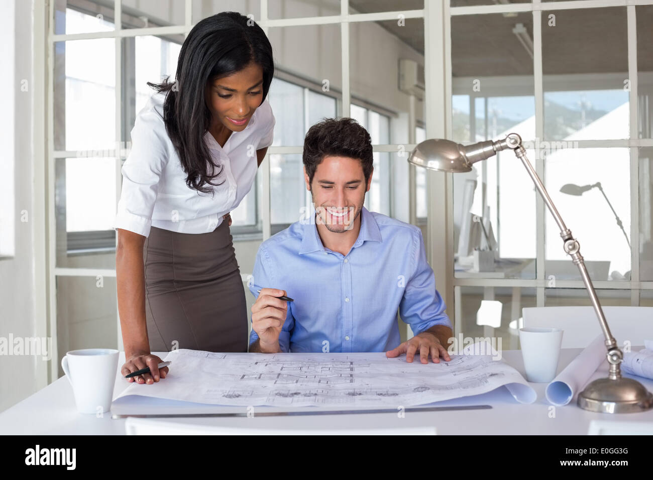 Architects working on blueprints Stock Photo