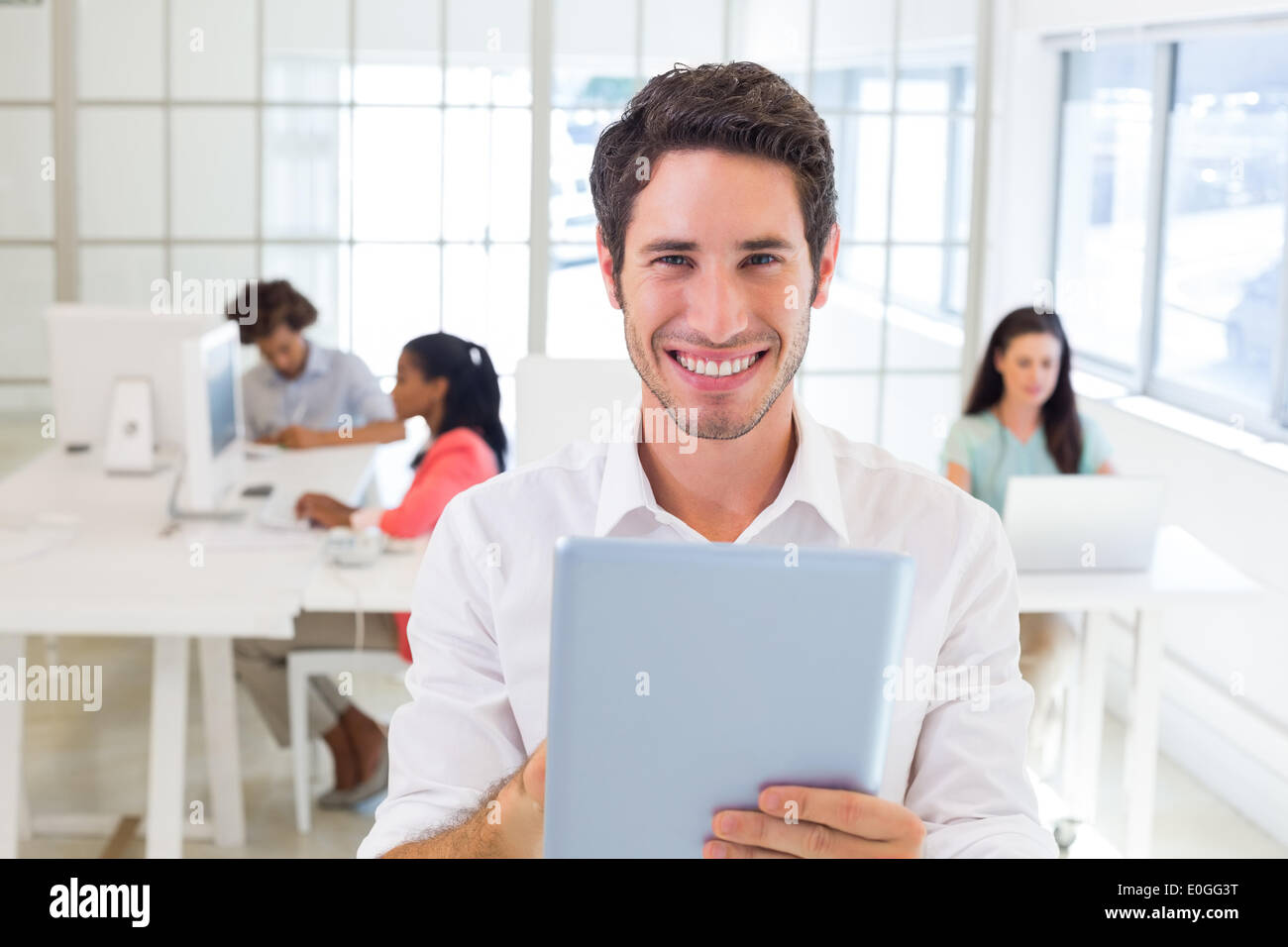 Businessman working on tablet pc Stock Photo