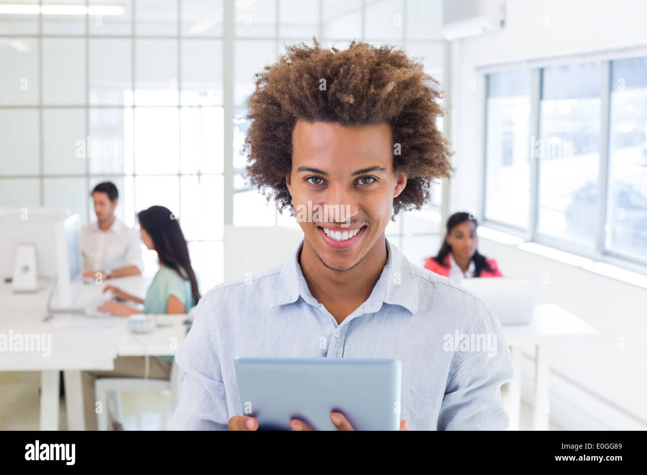 Casual worker using tablet pc Stock Photo