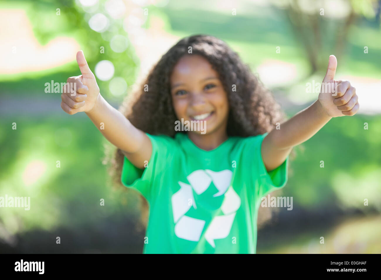 Young environmental activist smiling at the camera showing thumbs up ...