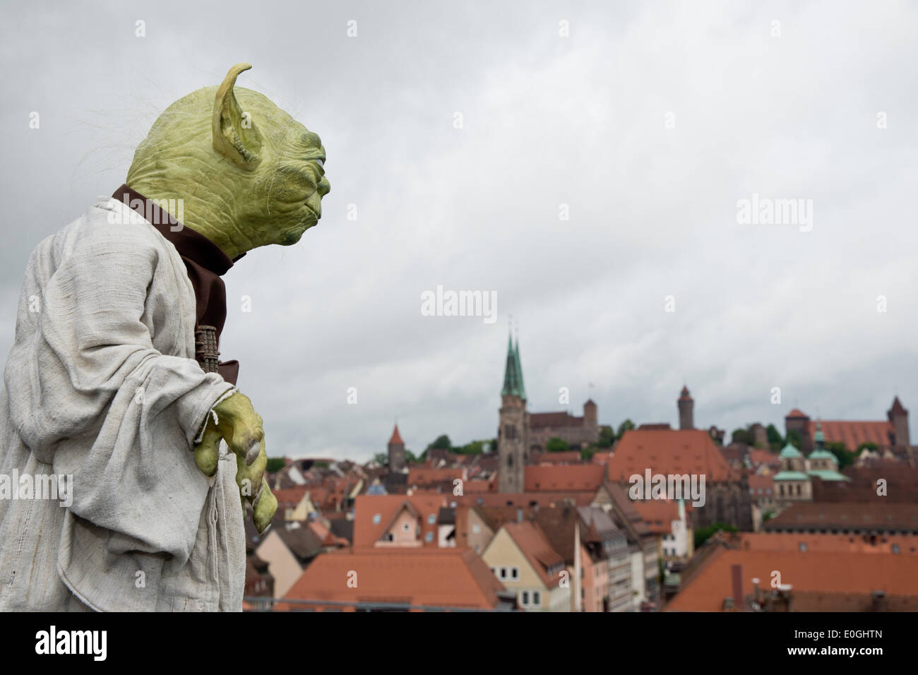 Nuremberg, Germany. 07th May, 2014. Yoda from the science fiction film Star Wars stands at the old town in Nuremberg, Germany, 07 May 2014. 64 year-old is planning a new museum for special effects, fantasy and science fiction films in Nuremberg. Photo: DANIEL KARMANN/dpa/Alamy Live News Stock Photo