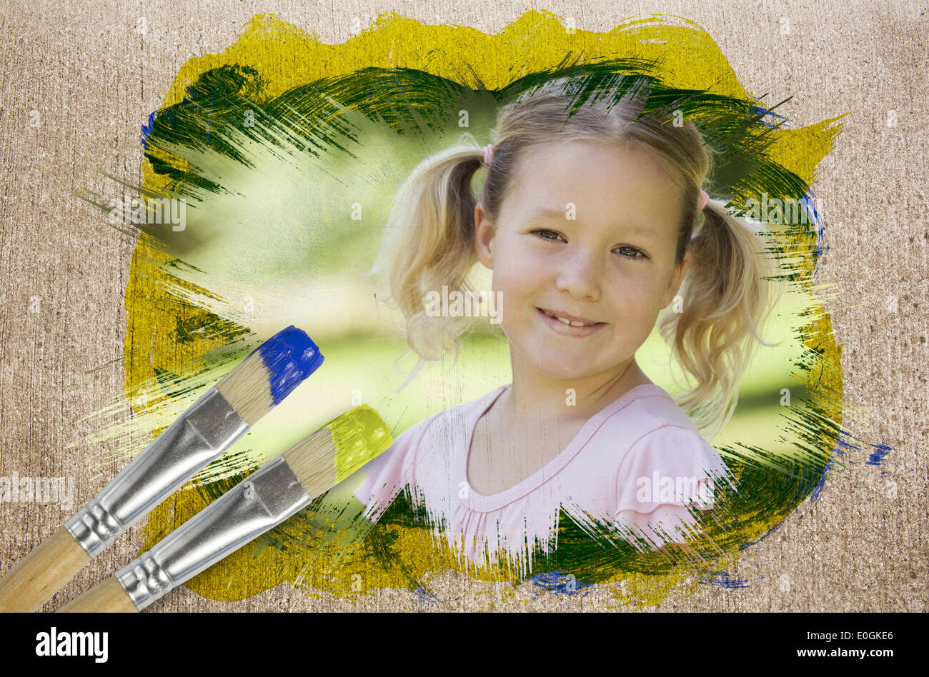 Composite image of little girl smiling in the park Stock Photo - Alamy