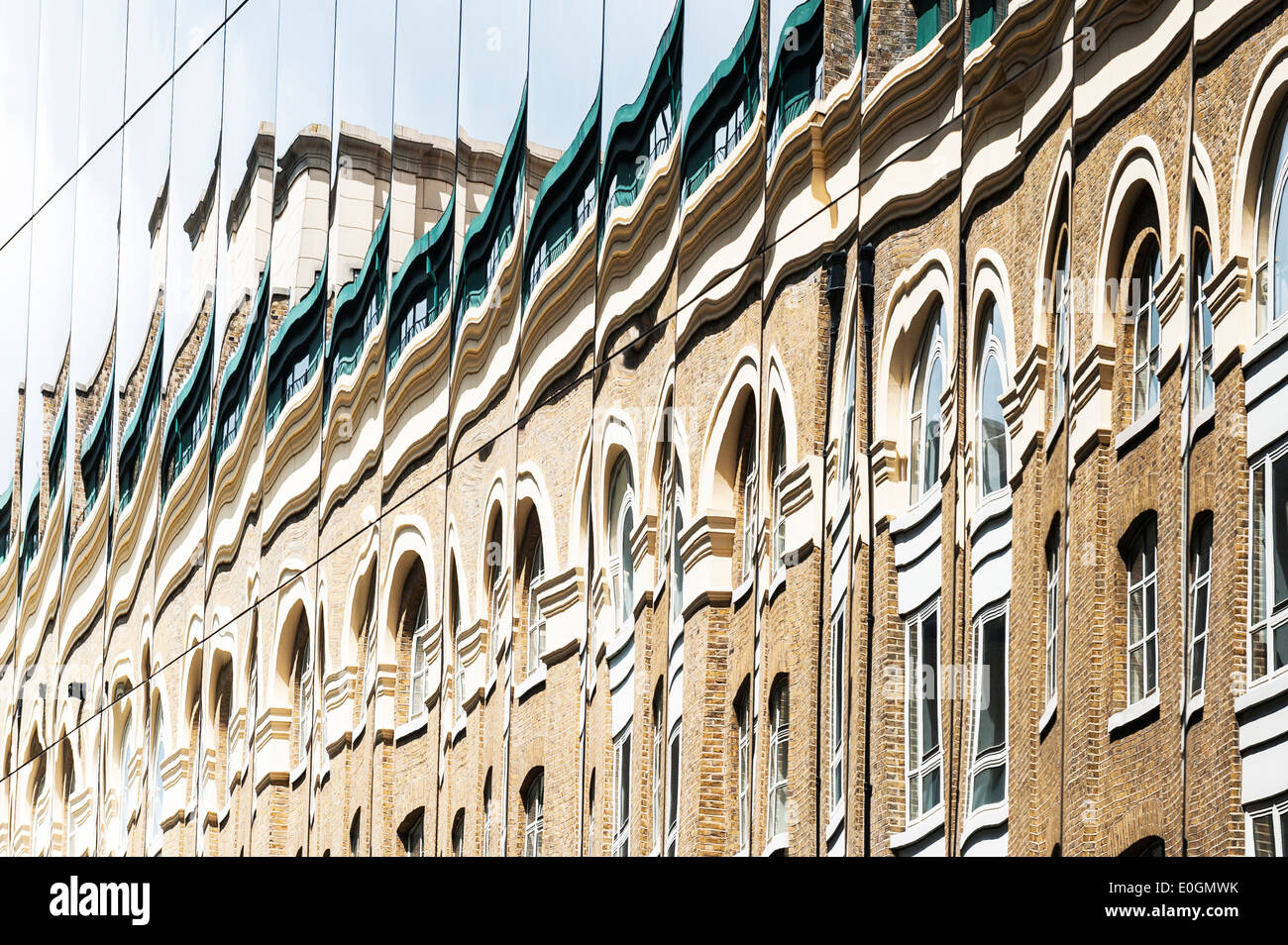 The distorted reflection of a building. Stock Photo