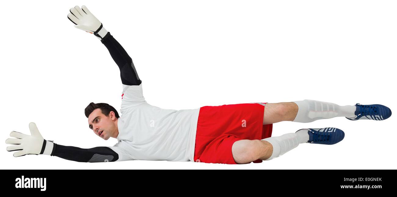Goalkeeper in white making a save Stock Photo