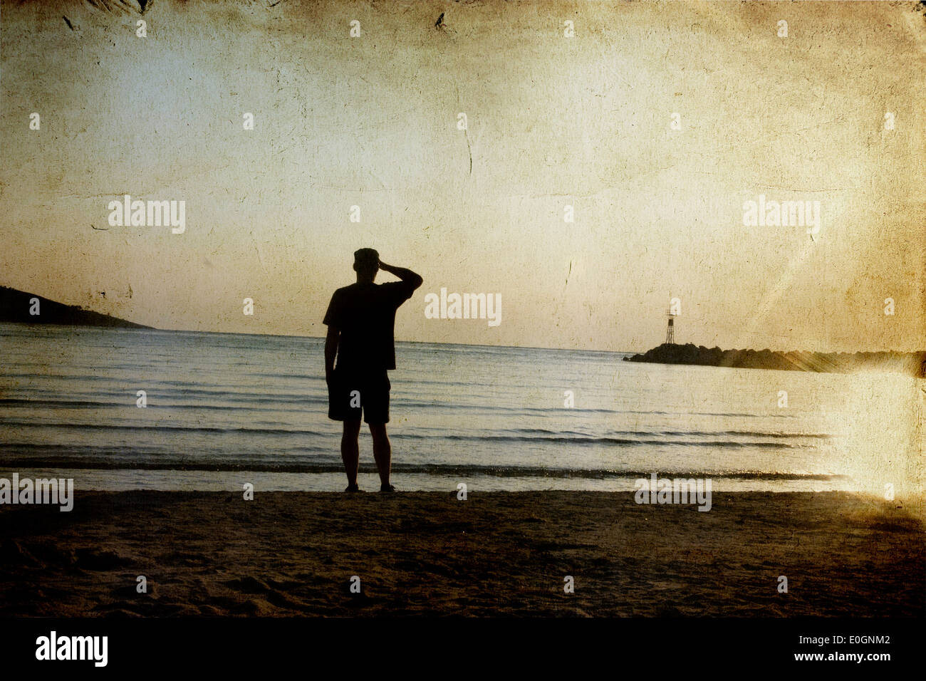Lonely man walking on coast hi-res stock photography and images - Alamy