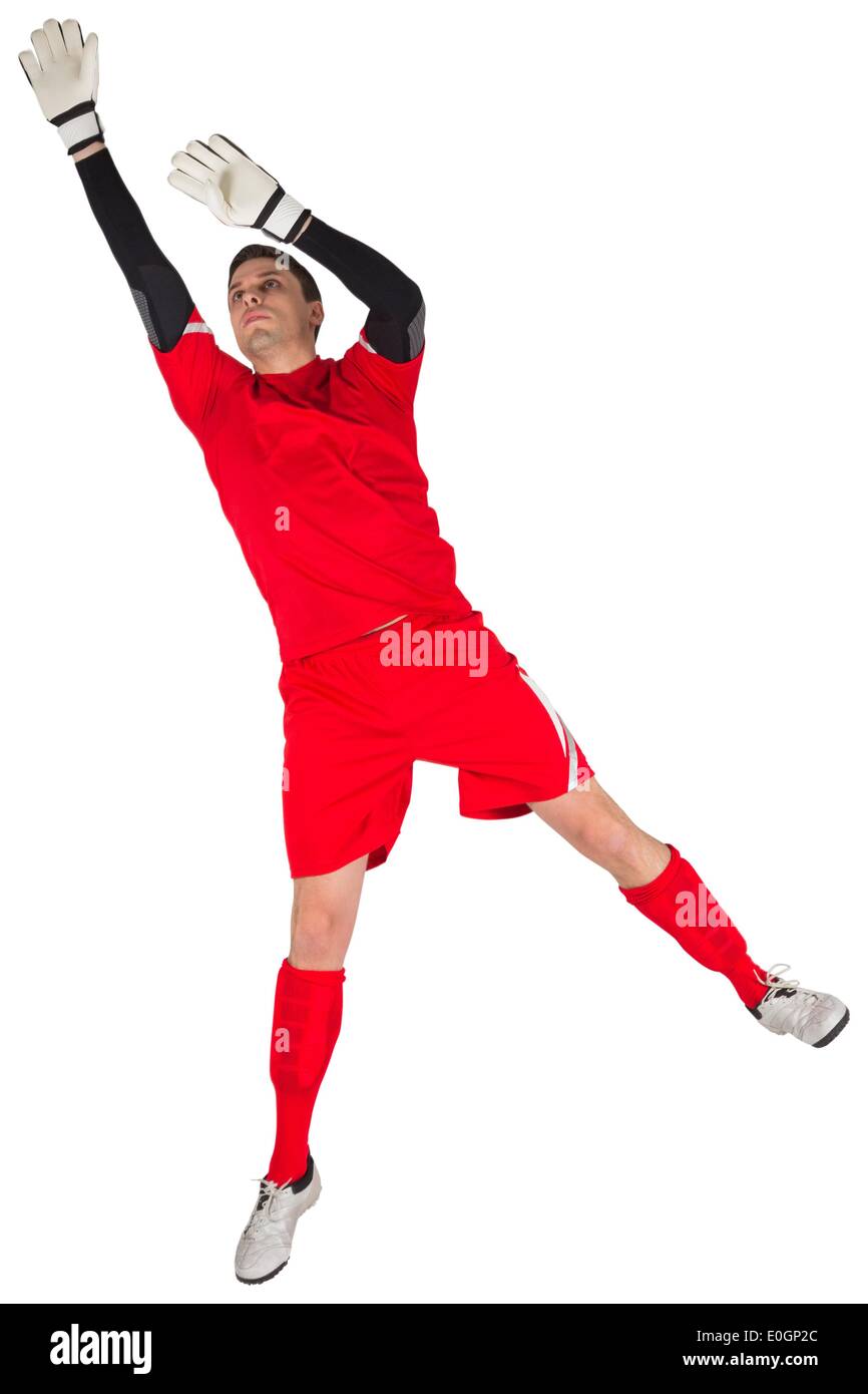 Fit goal keeper jumping up Stock Photo