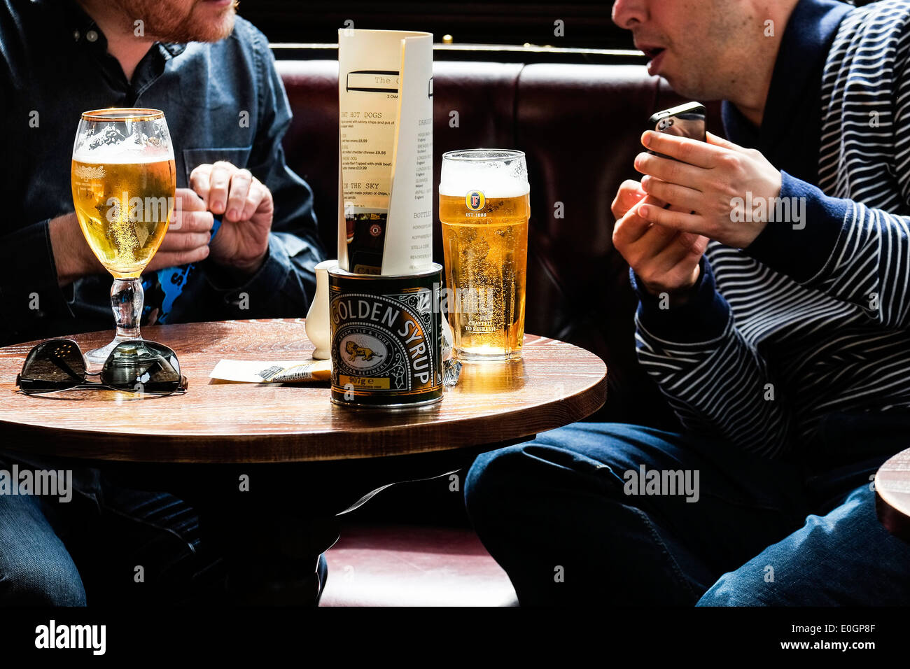 Friends relaxing in a pub. Stock Photo