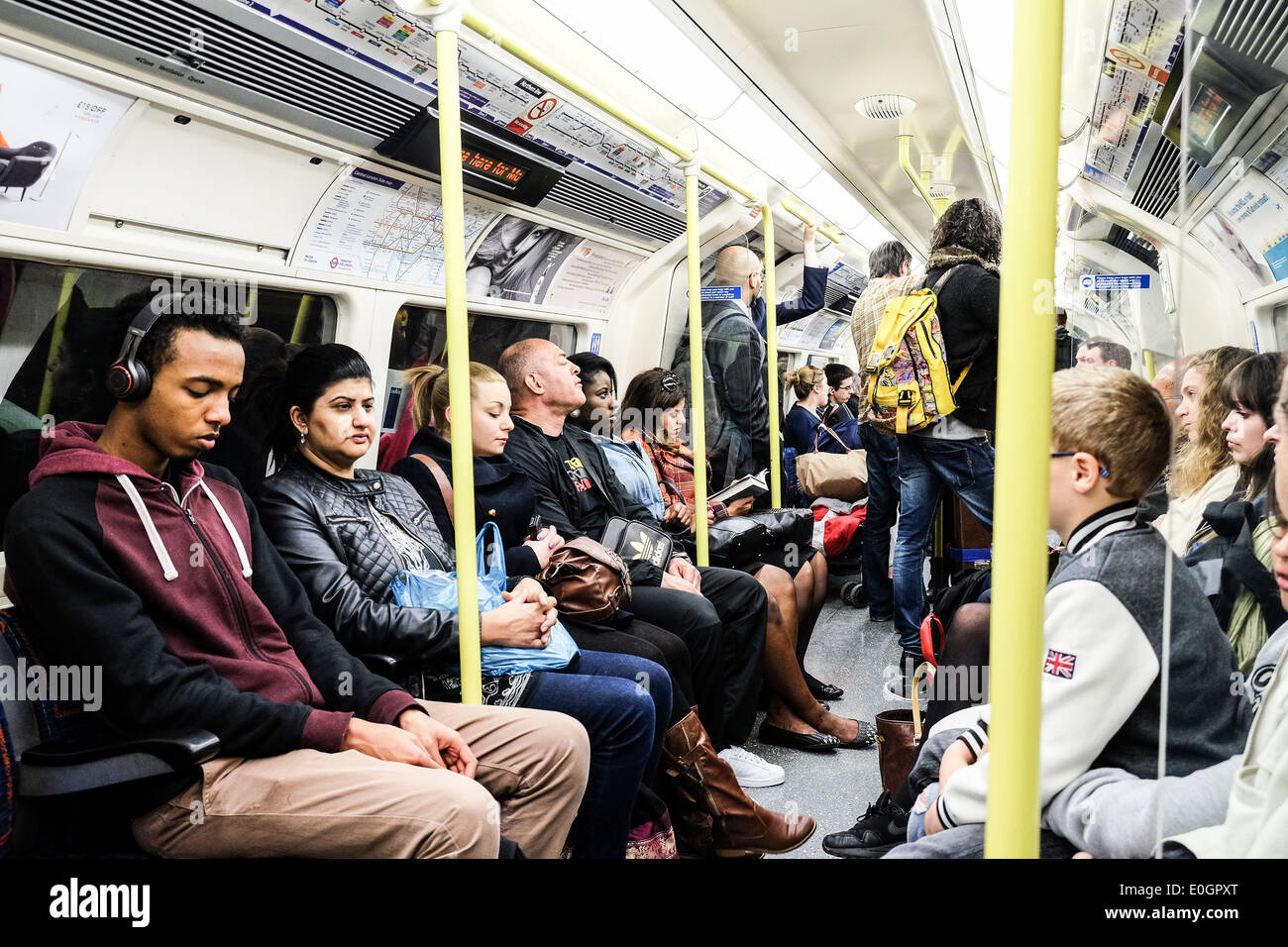 Commuters on a London tube train. Stock Photo