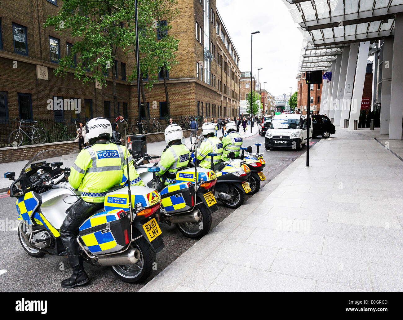 Four Metropolitan Police Motorcycle officers parked on a street in Southwark. Stock Photo