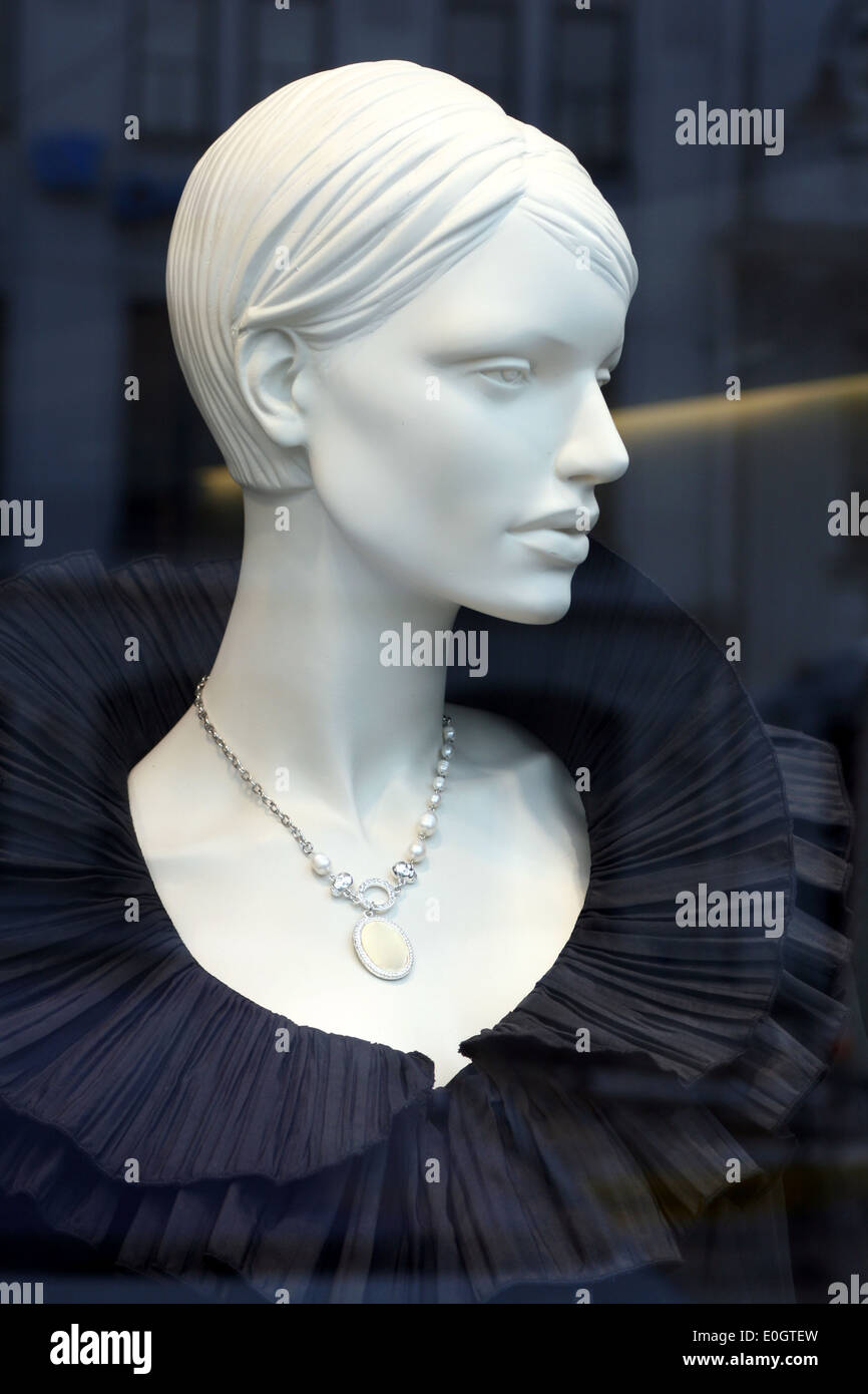 Luxury mannequin dressed in elegant black evening dress on display with ...