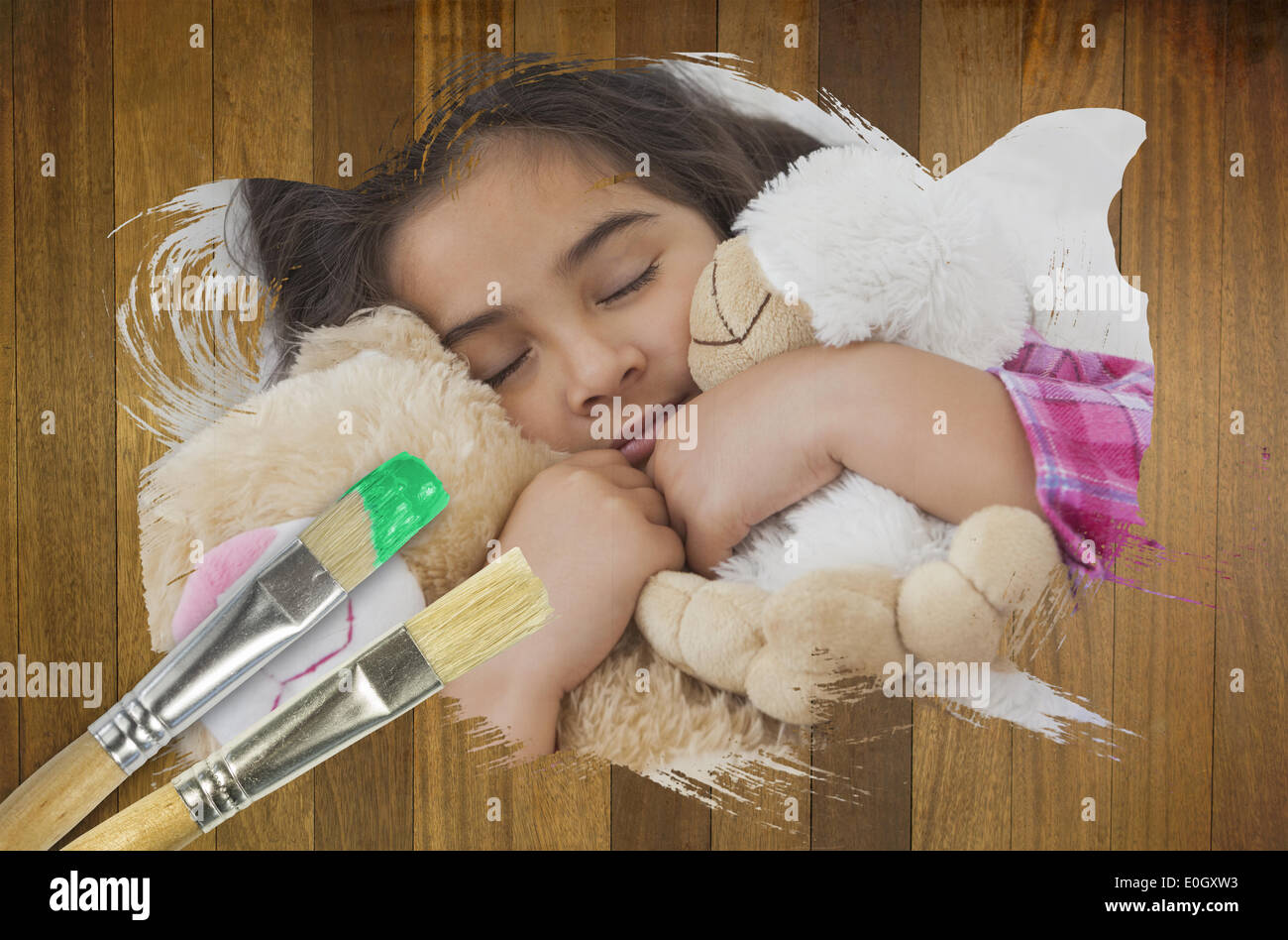 Composite image of little girl cuddling teddys Stock Photo