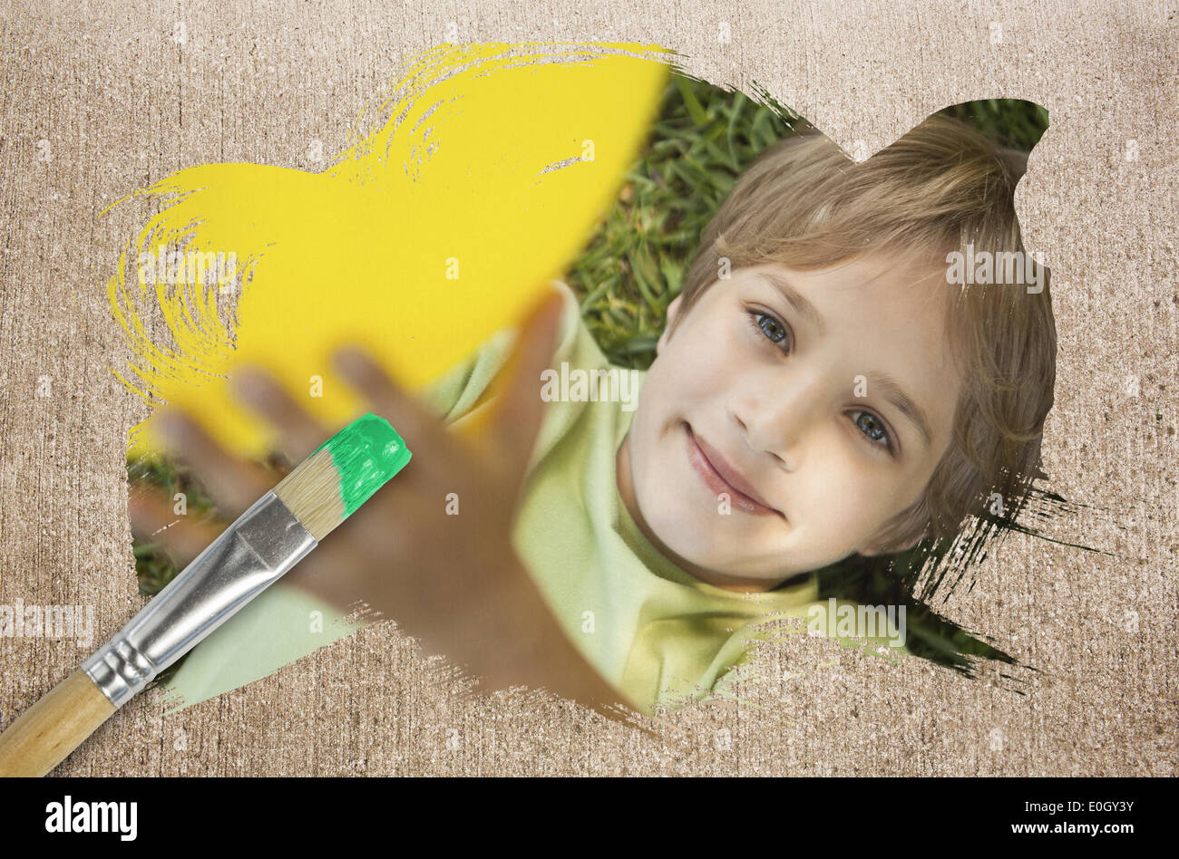 Composite image of little boy smiling at camera Stock Photo - Alamy