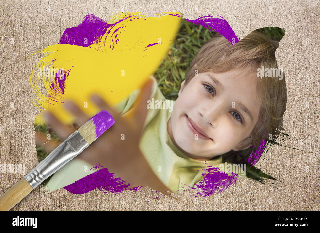 Composite image of little boy smiling at camera Stock Photo - Alamy