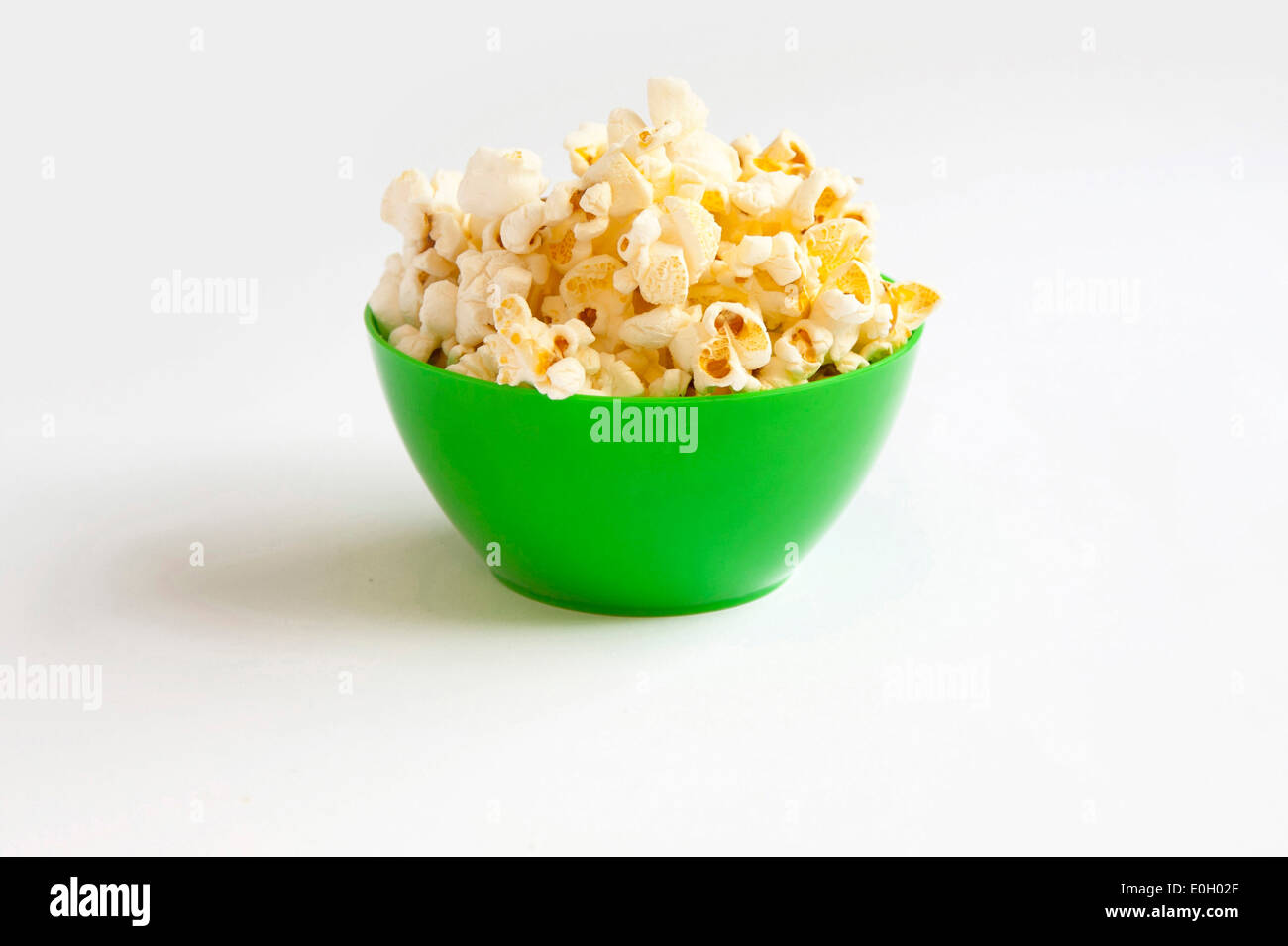 Popcorn in green bowl Stock Photo