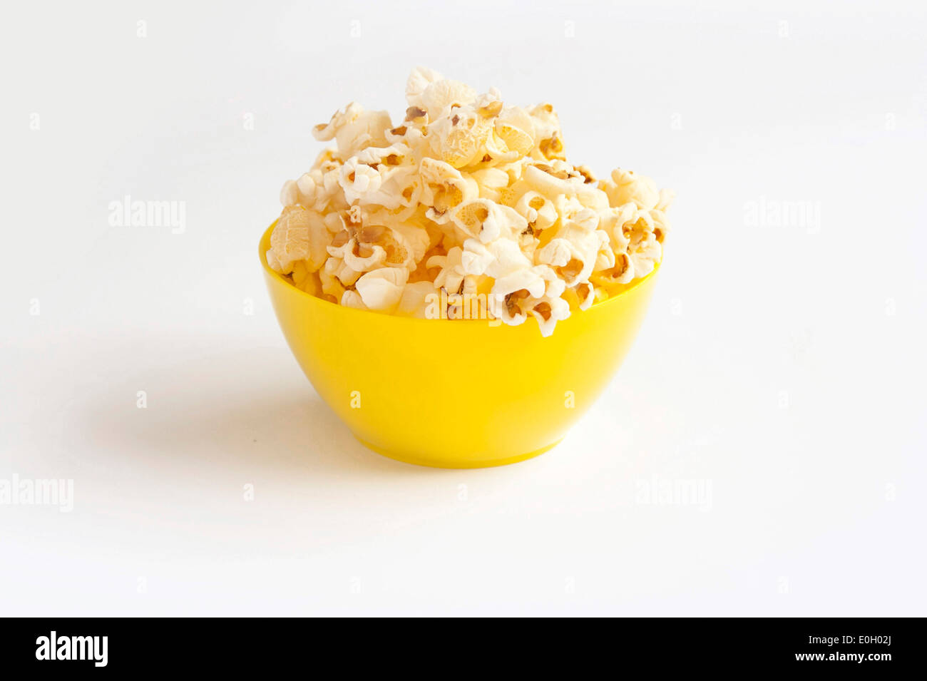 Popcorn in yellow bowl Stock Photo