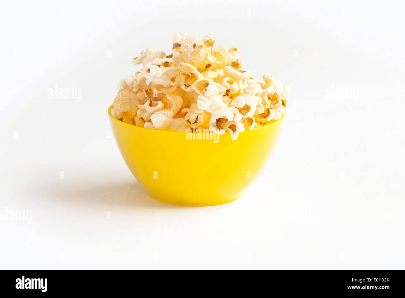 Popcorn in yellow bowl Stock Photo