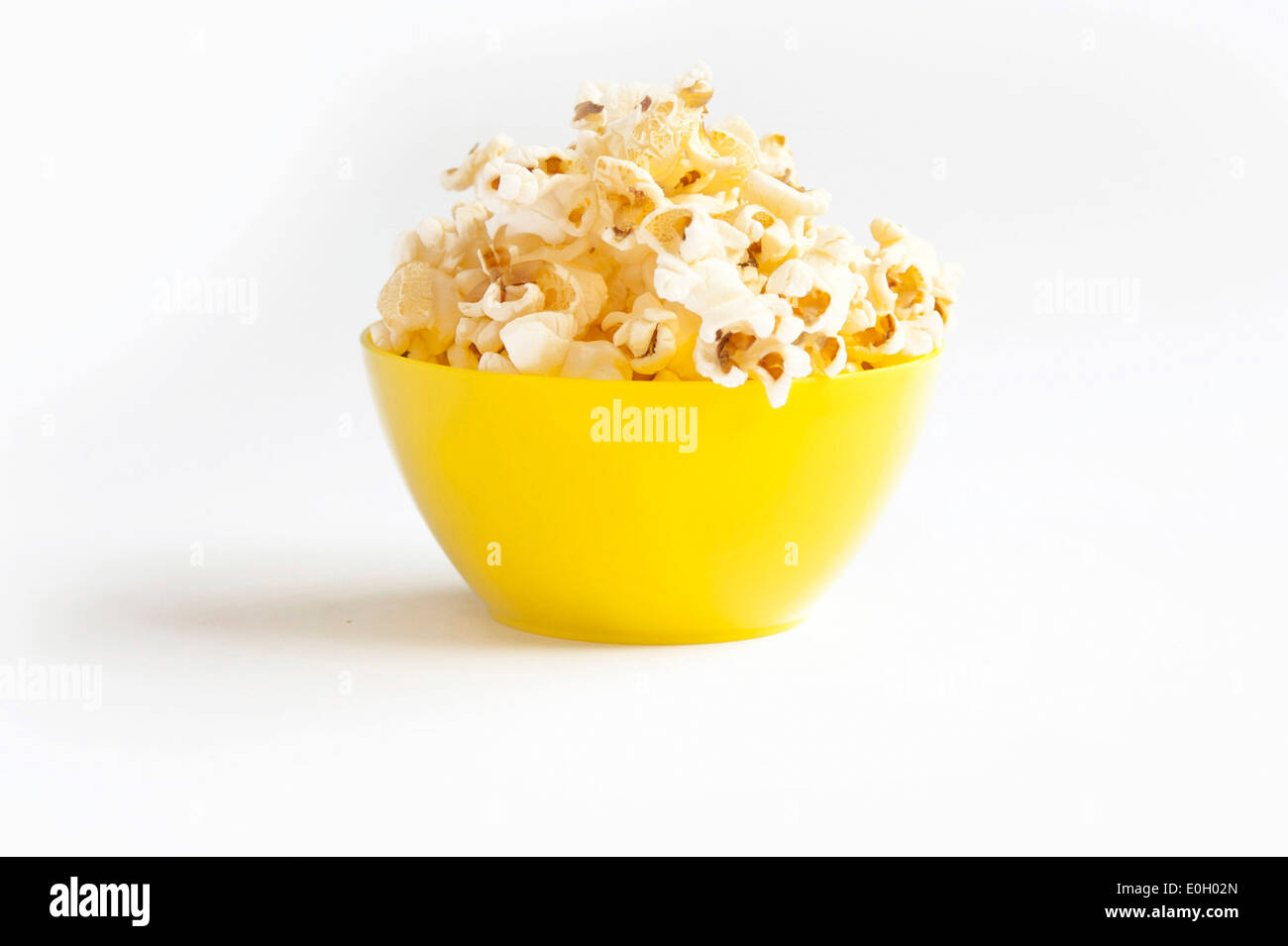Popcorn in yellow bowl Stock Photo