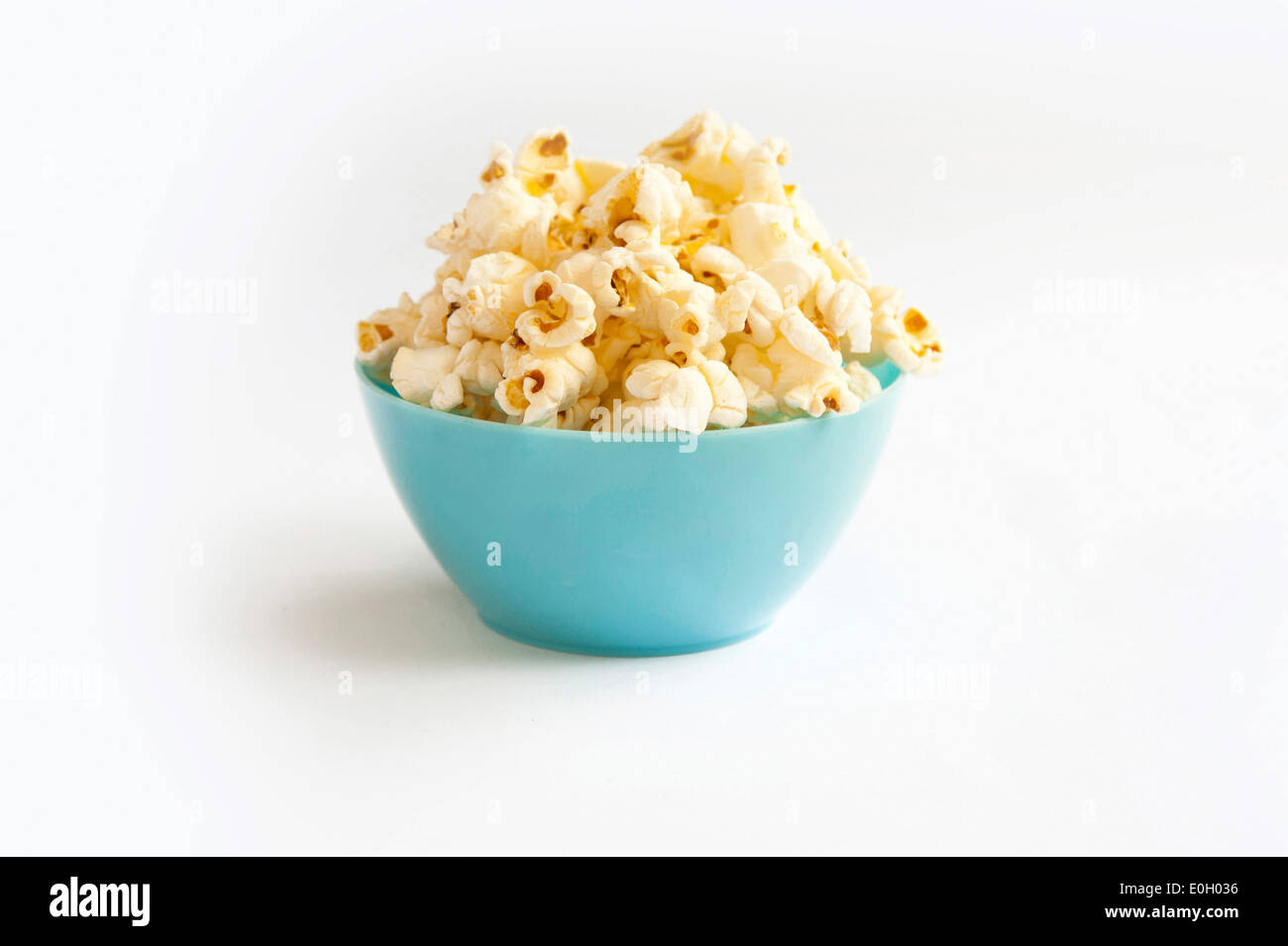 Popcorn in blue bowl Stock Photo