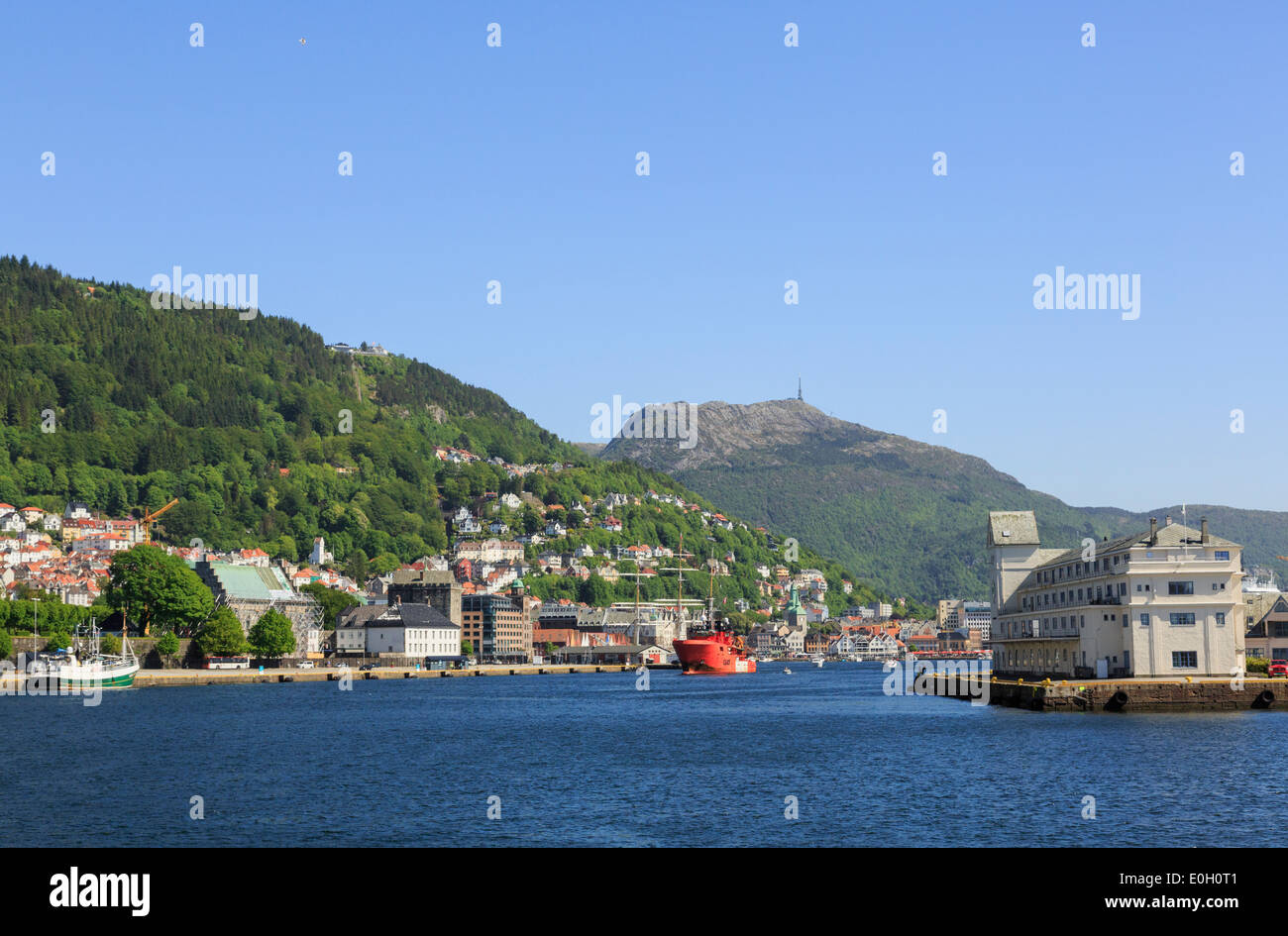 Offshore view across sea to buildings at entrance to Vågen harbour, Bergen, Hordaland, Norway, Scandinavia, Europe Stock Photo