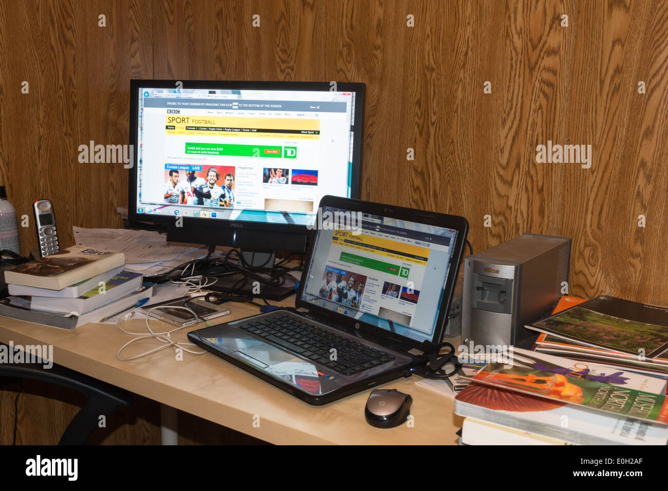 Untidy home office desk Stock Photo