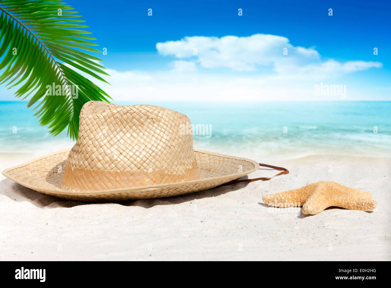 Straw Hat and Starfish on the Beach with much Copy Space Stock Photo ...