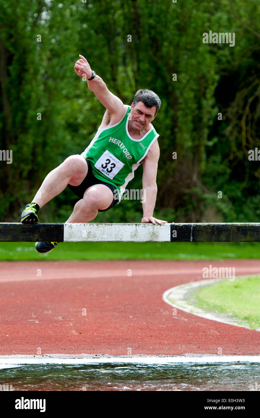 Athletics, men`s steeplechase at club level, UK Stock Photo - Alamy