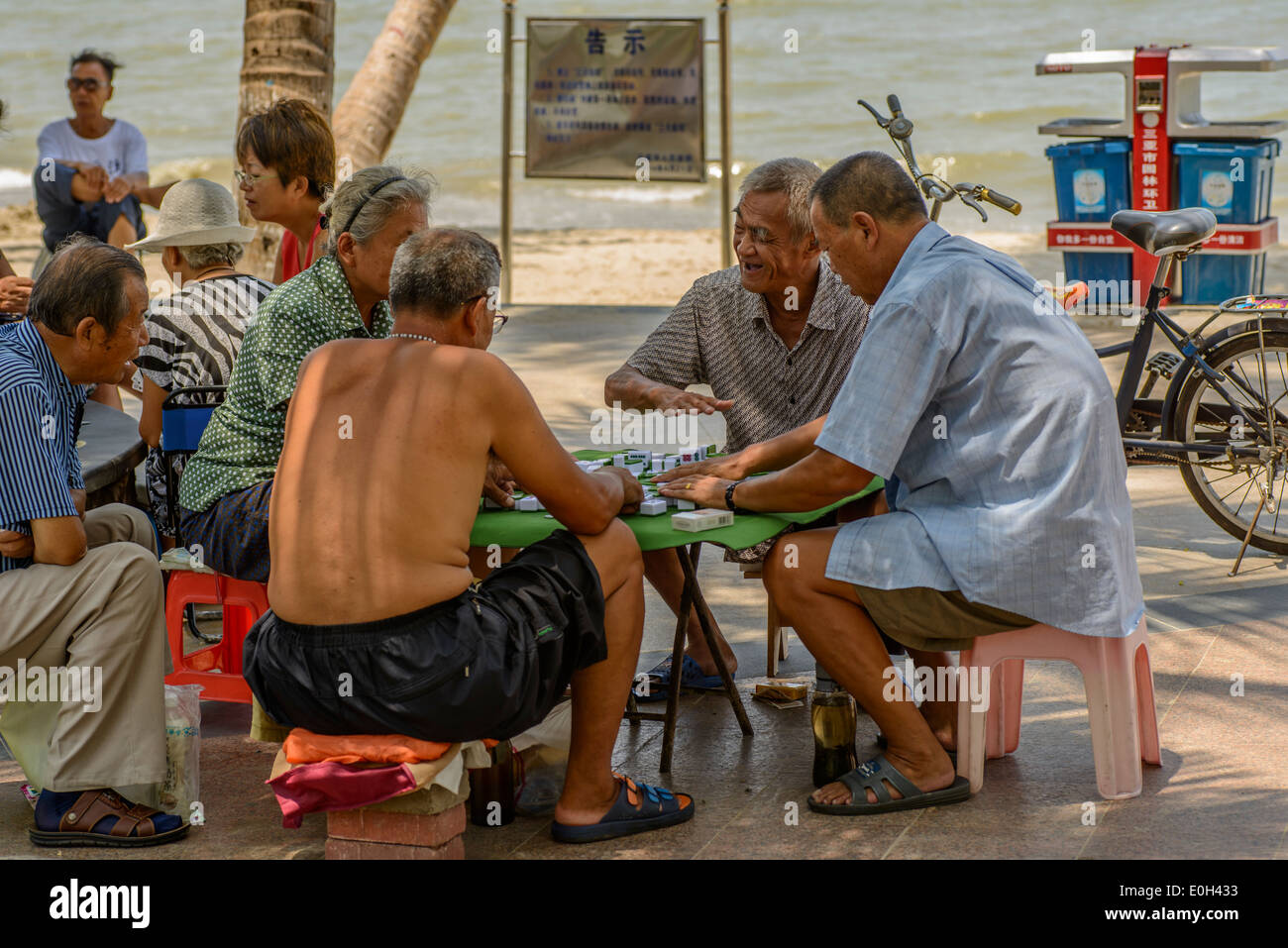 Some old people playing mahjong on the summer beach Stock Photo - Alamy