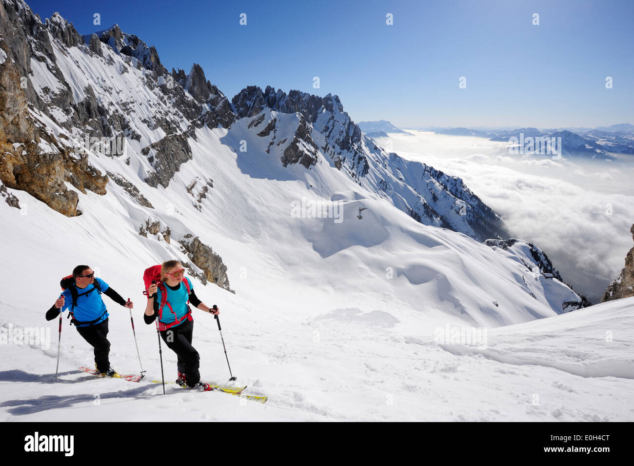Two backcountry skiers ascending to notch Rote-Rinn-Scharte, Kaiser-Express, Rote-Rinn-Scharte, Wilder Kaiser, Kaiser mountain r Stock Photo