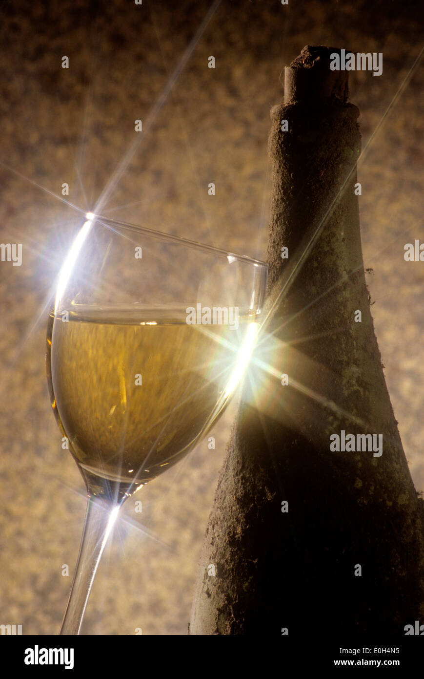 Old bottle of wine with a glass Stock Photo