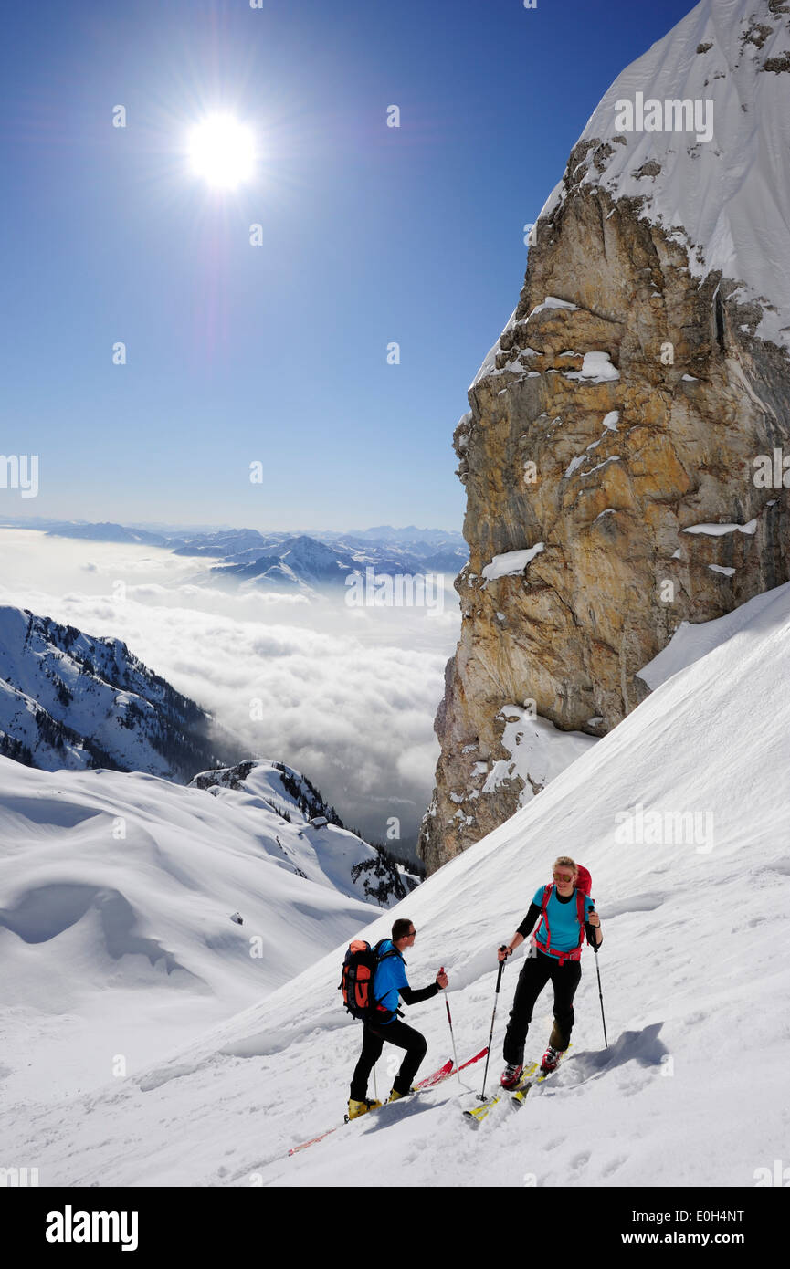 Two backcountry skiers ascending to notch Rote-Rinn-Scharte, Kaiser-Express, Rote-Rinn-Scharte, Wilder Kaiser, Kaiser mountain r Stock Photo