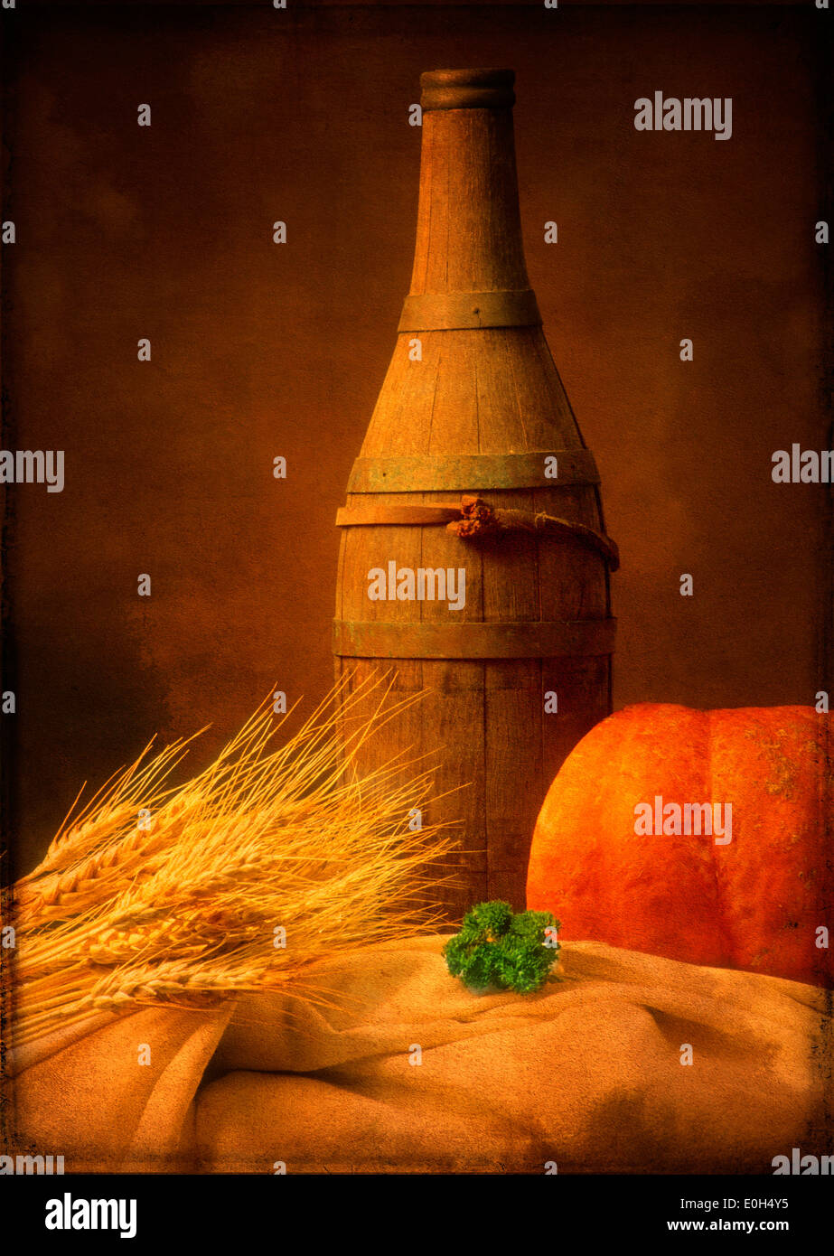 Rustic still life of food and drink with wheat, pumpkin and wooden cask bottle Stock Photo