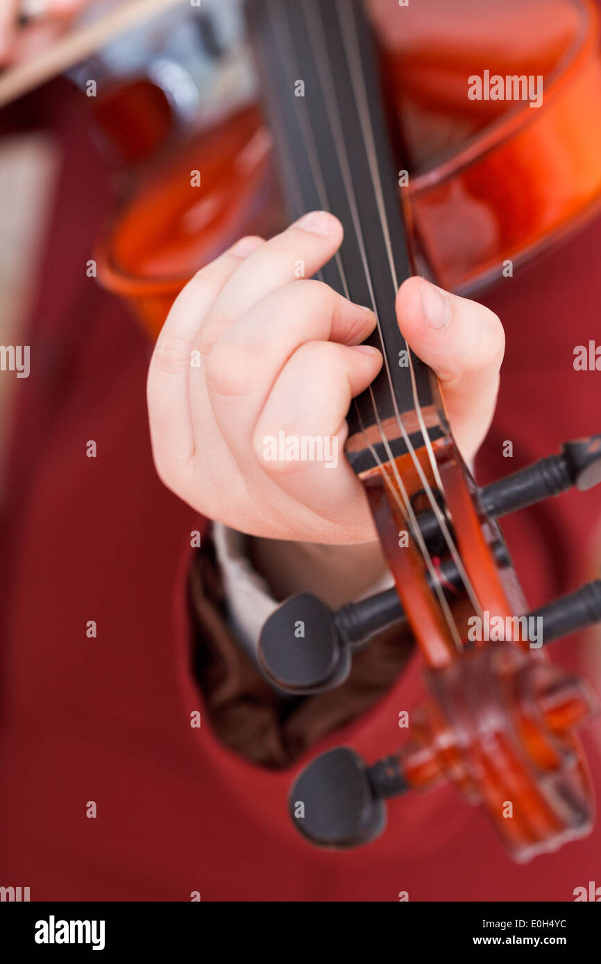 girl playing violin - chord on fingerboard close up Stock Photo - Alamy
