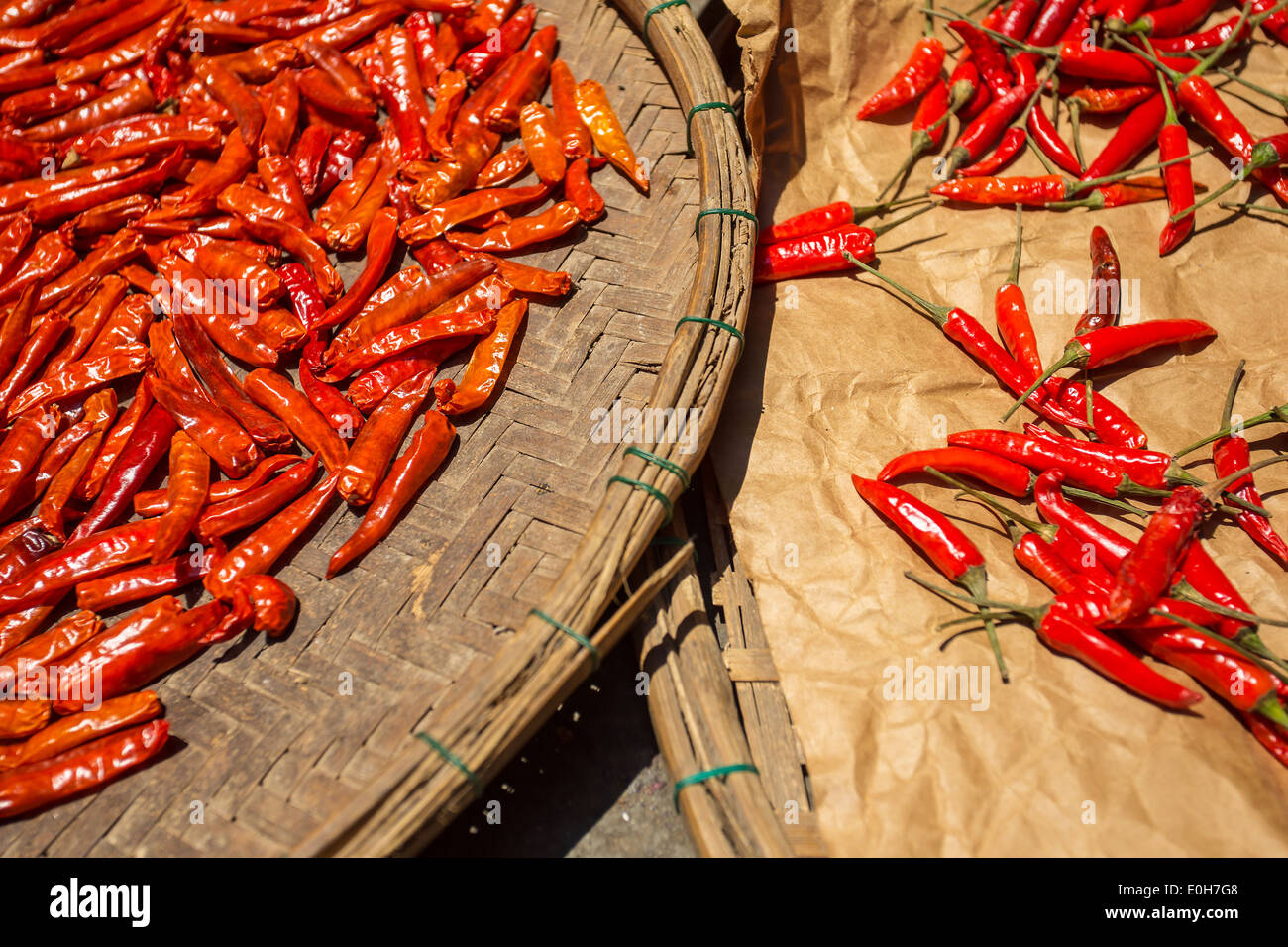 Red chilli pepper drying in the sun Stock Photo