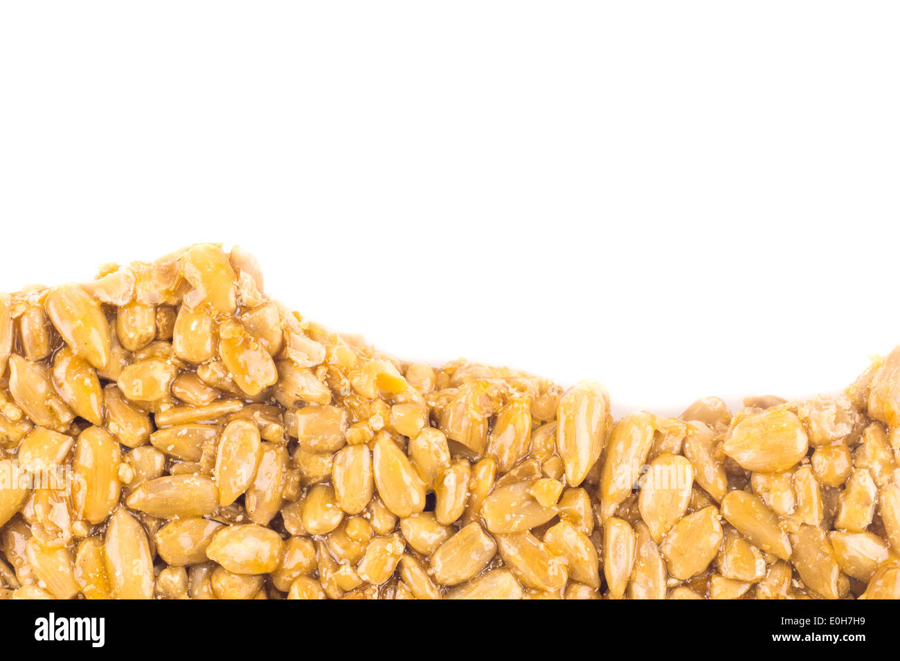 Nutsandhoney bar, oriental sweets from candied sunflower seeds isolated on white Stock Photo