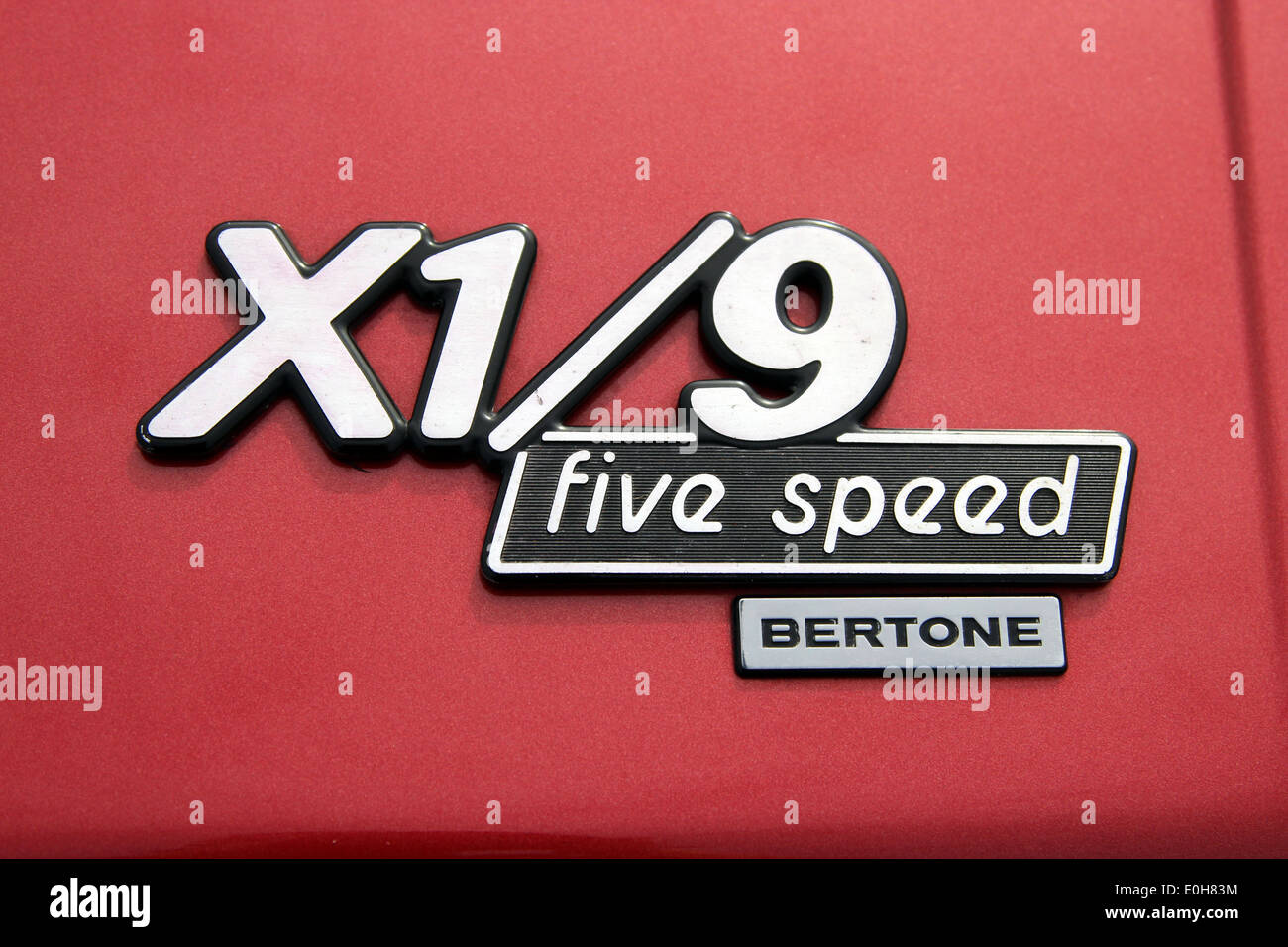 Car badge on a Fiat X1/9 five speed Bertone car. Stock Photo
