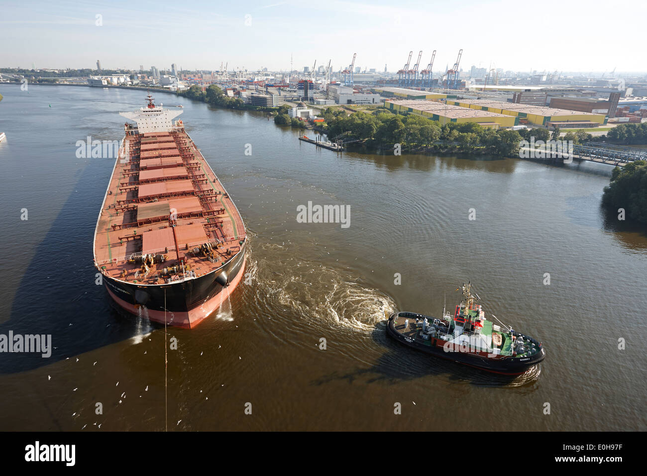 Tanker with tug boats on the river Elbe near Waltershof, Hamburg, Germany Stock Photo
