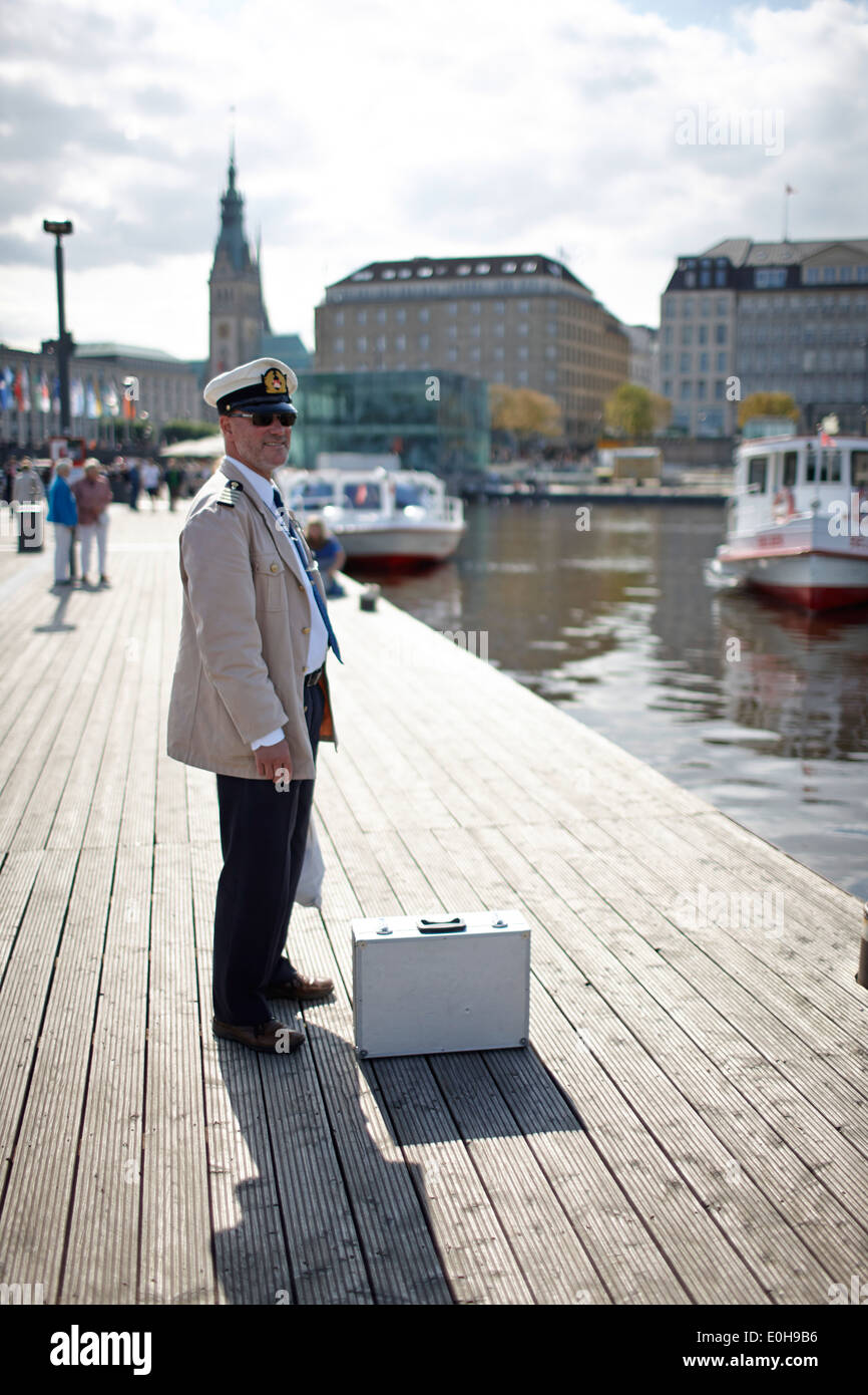 Captain at Alster Tourism pier, Inner Alster Lake, Hamburg, Germany Stock Photo