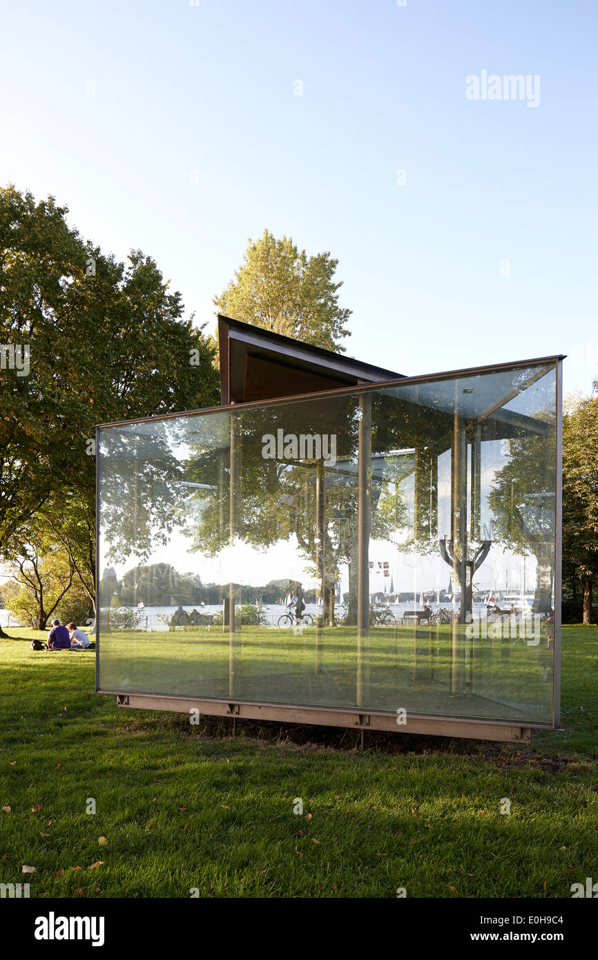 Glass pavilion reflecting Outer Alster Lake, art installation in a park near Faehrhausstrasse, East bank of the Outer Alster Lak Stock Photo